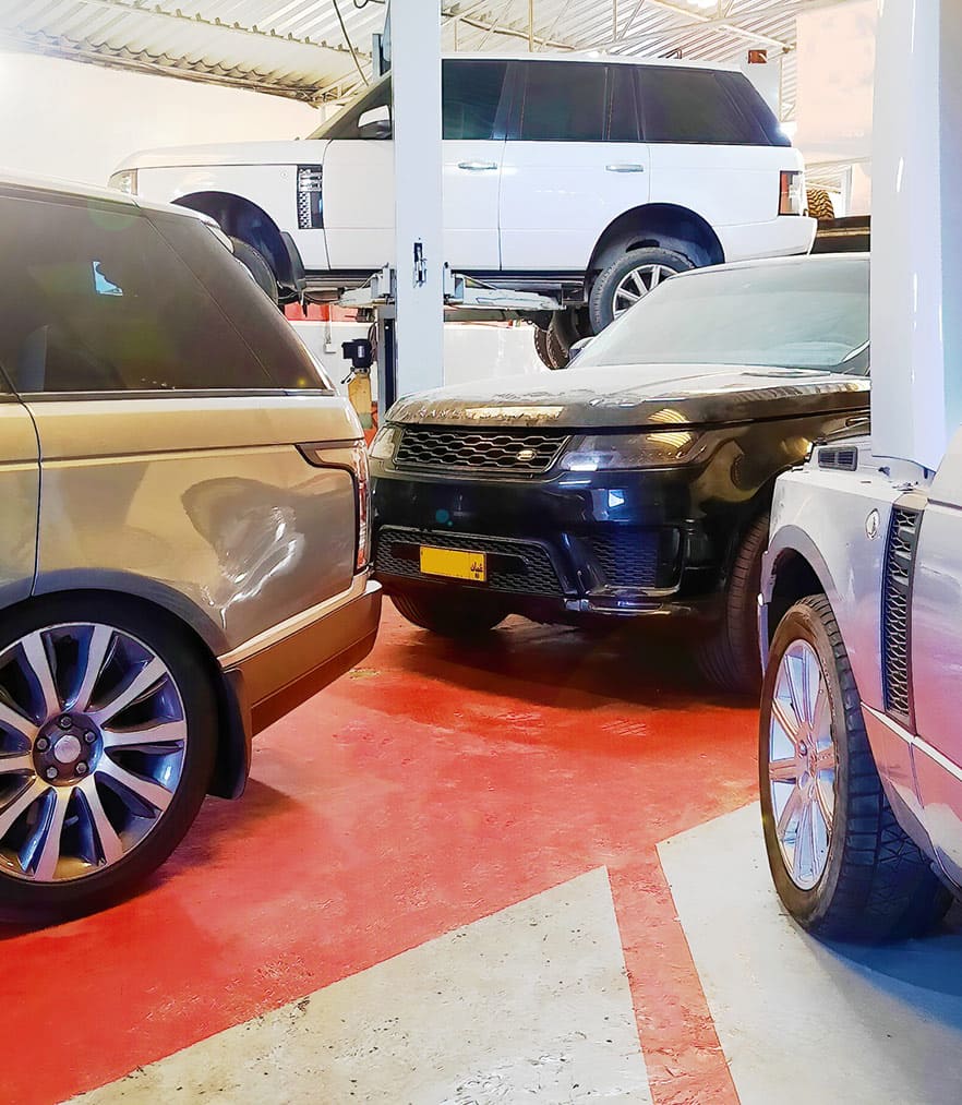 range rover cars inside repair shop